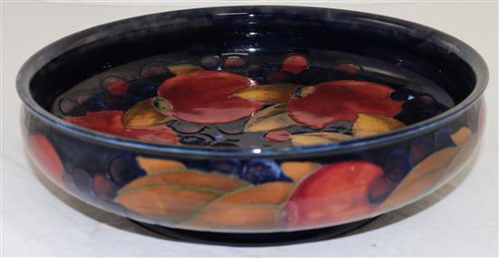 A William Moorcroft pomegranate blue ground footed shallow bowl, diameter 29cm